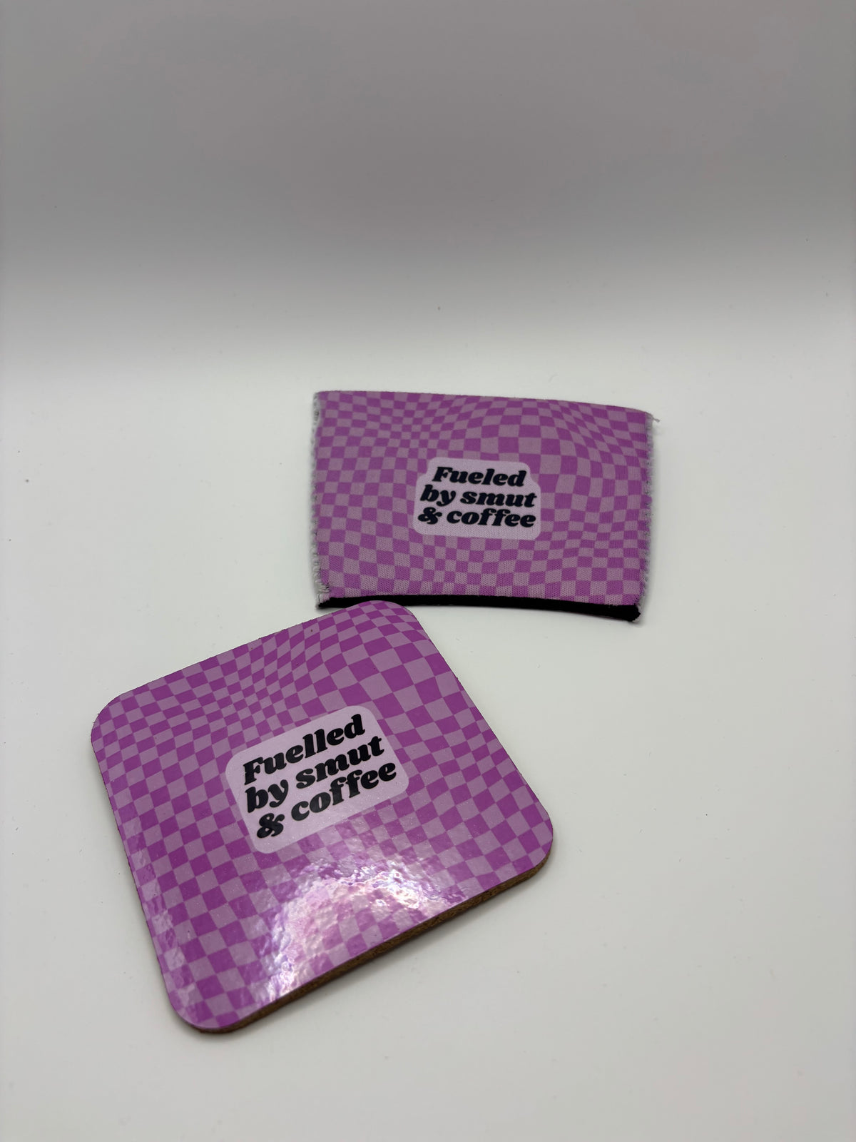 Fuelled by Smut & Coffee Cork Coaster – Purple Checkerboard