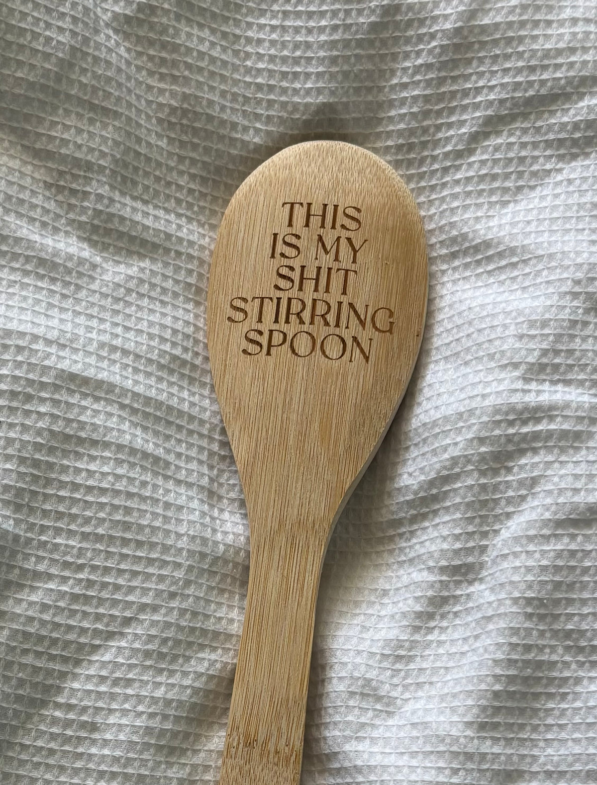Laser engraved wooden spoon with humorous text