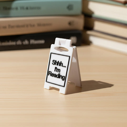 White 3D printed mini A-frame sign reading Shhh... I'm Reading in black text
